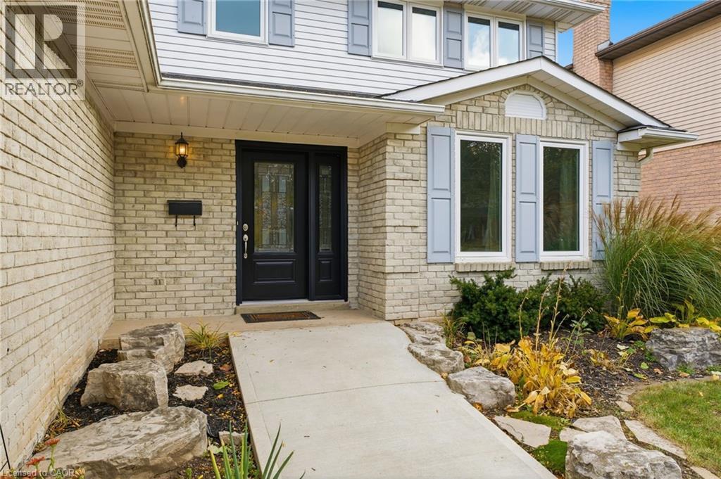 Entry with concrete walkway and landscaped garden - 84 Chatterson Drive, Ancaster, ON - Outdoor
