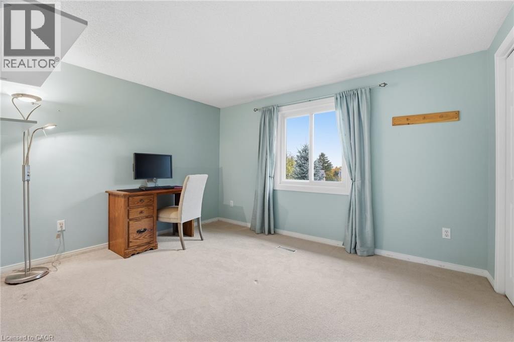 Bedroom (currently used as office) facing backyard with closet - 84 Chatterson Drive, Ancaster, ON - Indoor