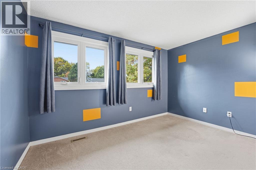 Bedroom facing street with closet - 84 Chatterson Drive, Ancaster, ON - Indoor Photo Showing Other Room