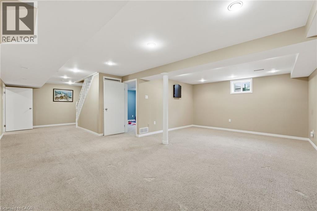 Basement open recreation space with view into office with window - 84 Chatterson Drive, Ancaster, ON - Indoor Photo Showing Basement