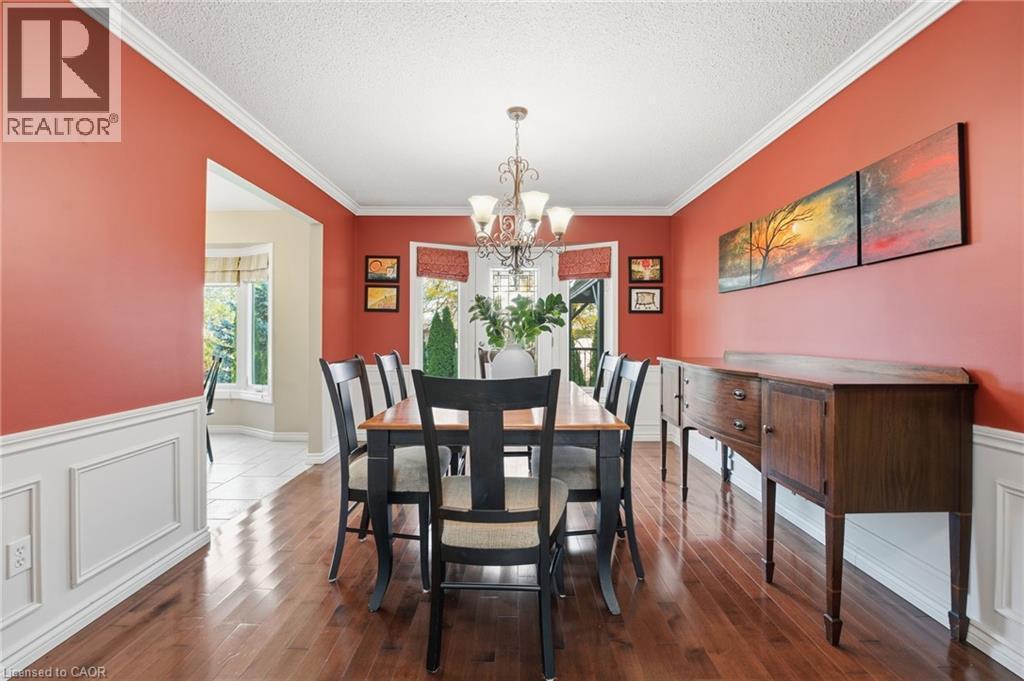 Formal dining room with door to backyard deck and view of yard - 84 Chatterson Drive, Ancaster, ON - Indoor Photo Showing Dining Room