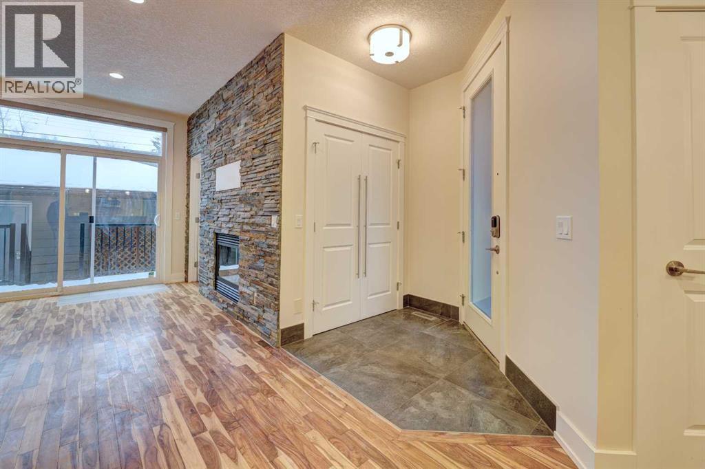 2, 308 12 Avenue Ne, Calgary, AB - Indoor Photo Showing Other Room With Fireplace