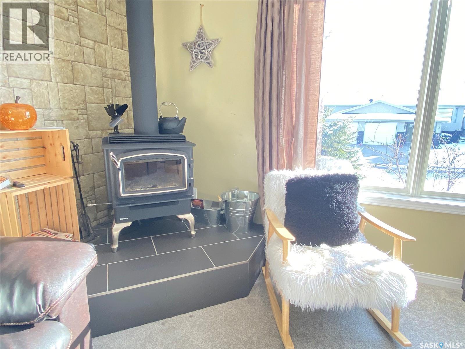 11 Harrigan Crescent, Maple Creek, SK - Indoor With Fireplace