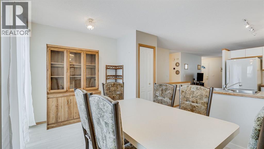 Dining room - 42, 105 Elm Place, Okotoks, AB - Indoor Photo Showing Other Room