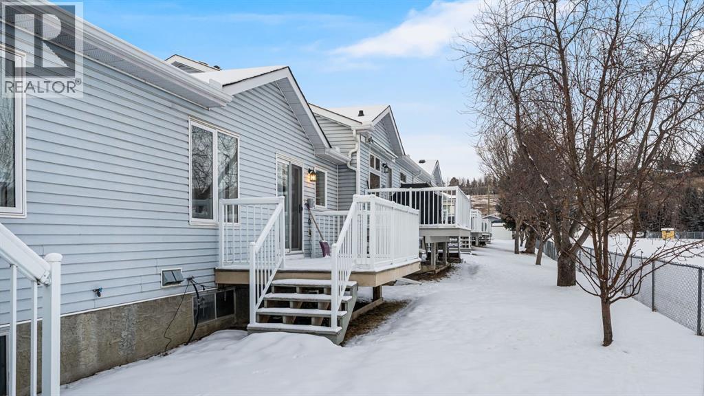 Back deck looking out on open field - 42, 105 Elm Place, Okotoks, AB - Outdoor