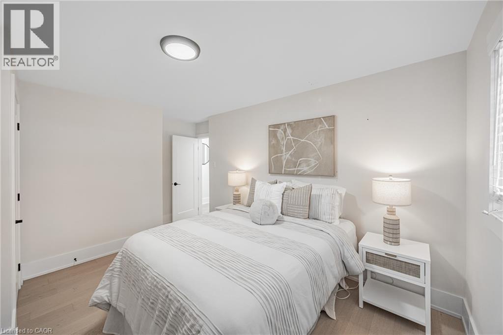 2nd Bedroom featuring baseboards and light wood-style floors - 248 Wales Crescent, Oakville, ON - Indoor Photo Showing Bedroom
