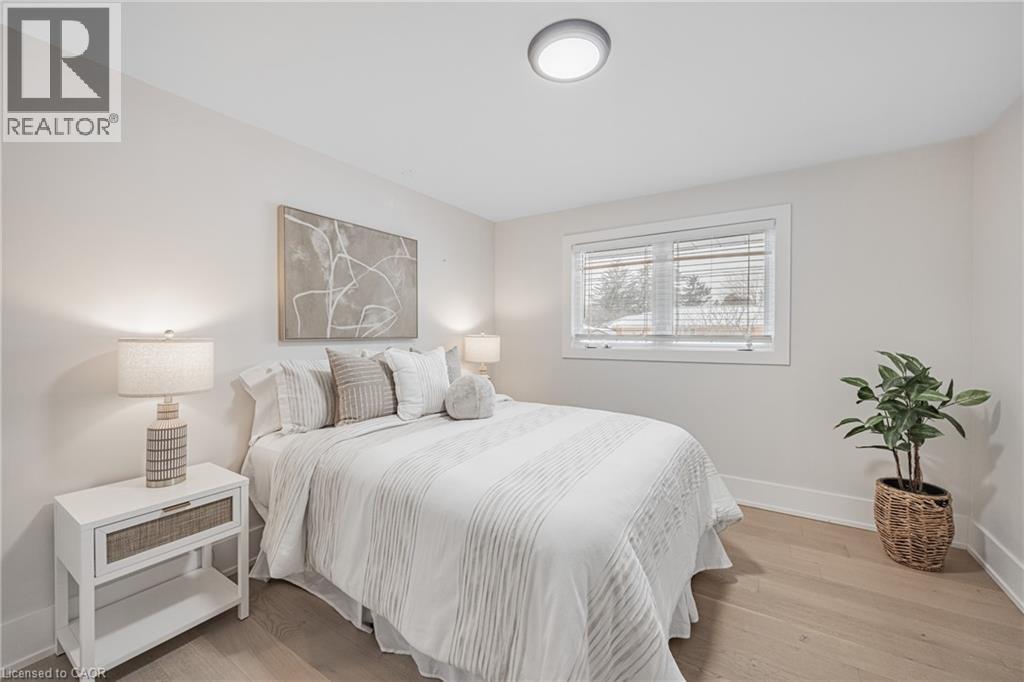 Bedroom with baseboards and light wood finished floors - 248 Wales Crescent, Oakville, ON - Indoor Photo Showing Bedroom