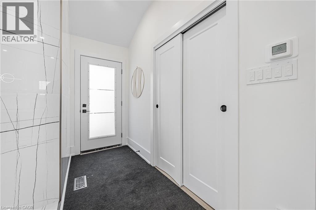 Entryway with carpet and lofted ceiling - 248 Wales Crescent, Oakville, ON - Indoor Photo Showing Other Room