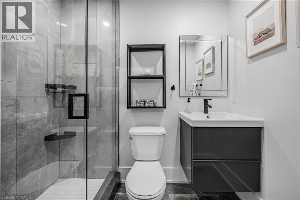 Full bath featuring a marble finish shower and vanity - 248 Wales Crescent, Oakville, ON - Indoor Photo Showing Bathroom