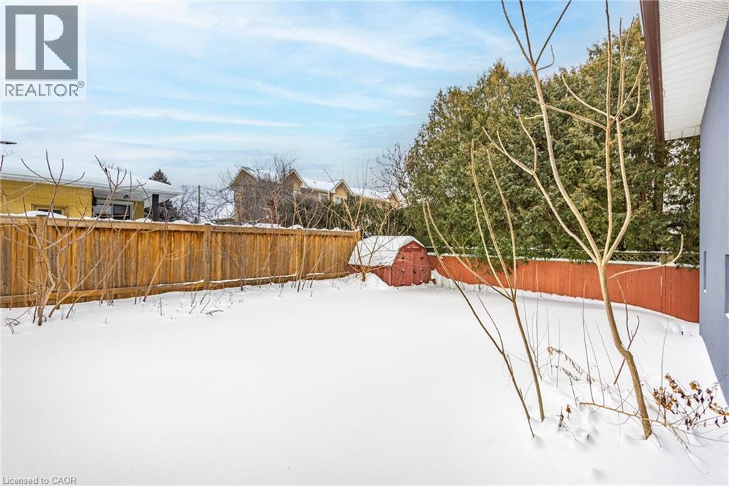 Snowy yard with a fenced backyard and a shed - 248 Wales Crescent, Oakville, ON - Outdoor