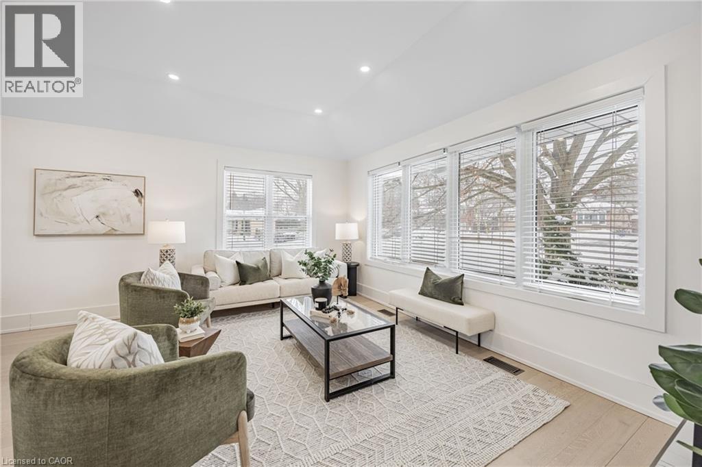 Living area featuring vaulted ceiling, recessed lighting, and light wood-type flooring - 248 Wales Crescent, Oakville, ON - Indoor Photo Showing Living Room