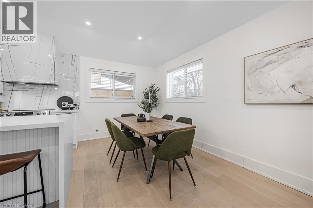 Dining room with light wood-style floors, recessed lighting, and vaulted ceiling - 248 Wales Crescent, Oakville, ON - Indoor Photo Showing Dining Room