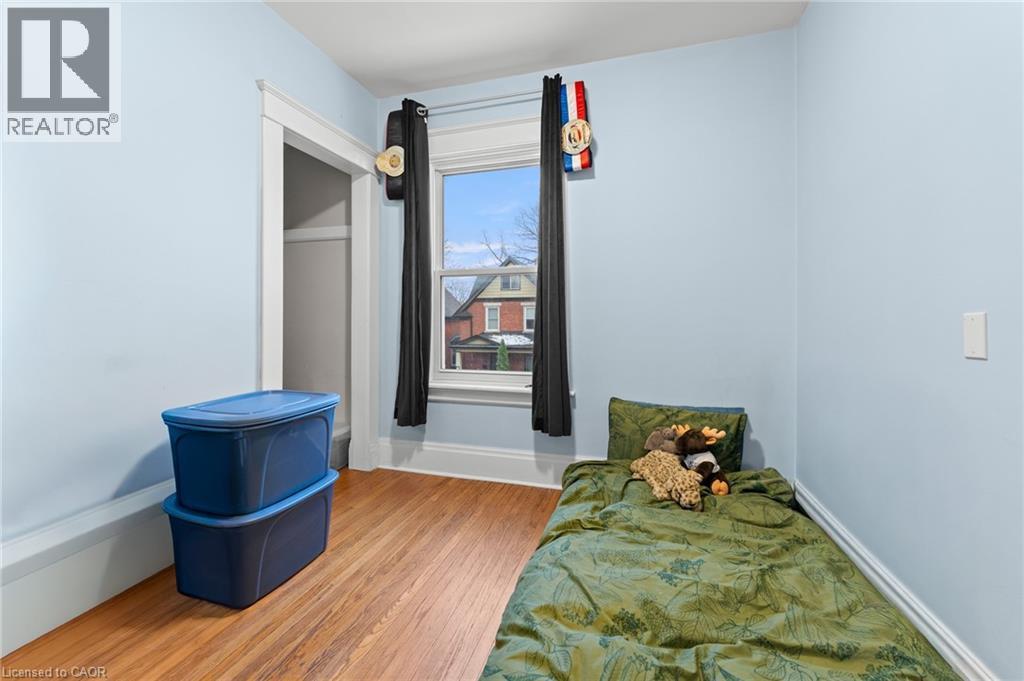 Bedroom featuring wood finished floors and baseboards - 58 Hohner Avenue, Kitchener, ON - Indoor Photo Showing Bedroom