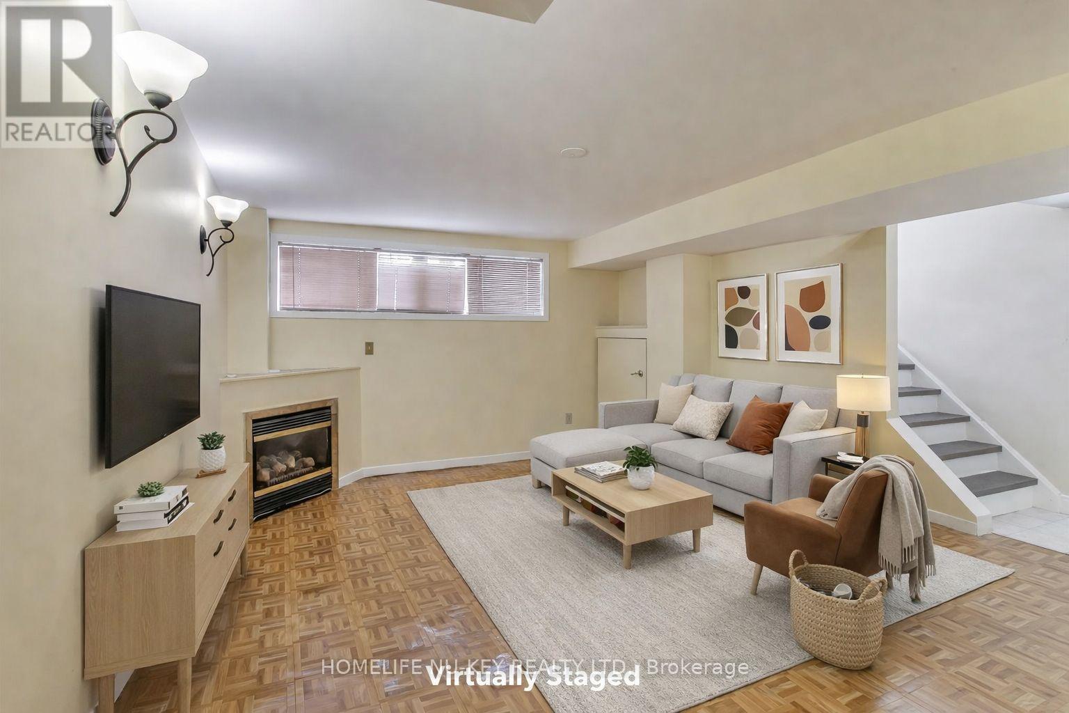 Virtually Staged Basement - 2443 Brookhurst Road, Mississauga, ON - Indoor Photo Showing Living Room With Fireplace
