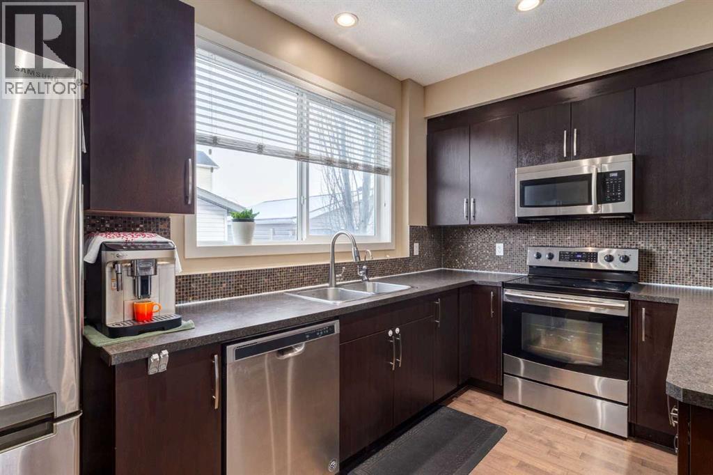 152 New Brighton Grove Se, Calgary, AB - Indoor Photo Showing Kitchen With Double Sink