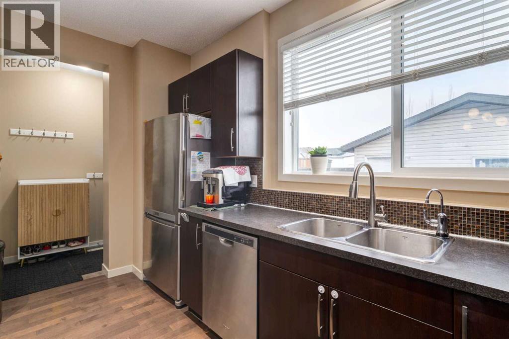 152 New Brighton Grove Se, Calgary, AB - Indoor Photo Showing Kitchen With Double Sink