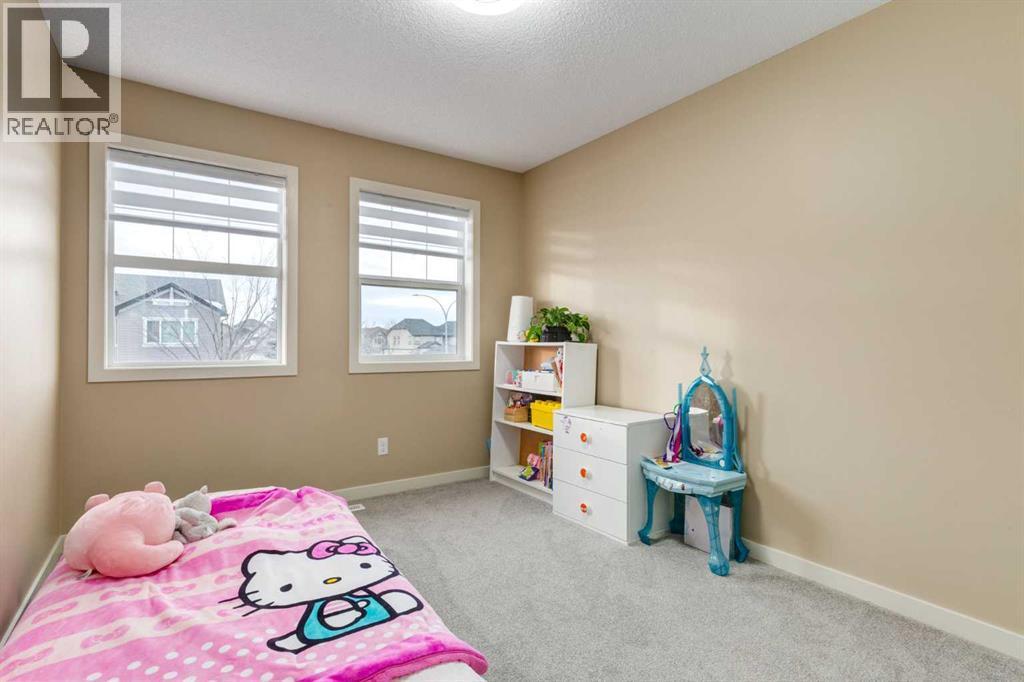 152 New Brighton Grove Se, Calgary, AB - Indoor Photo Showing Bedroom