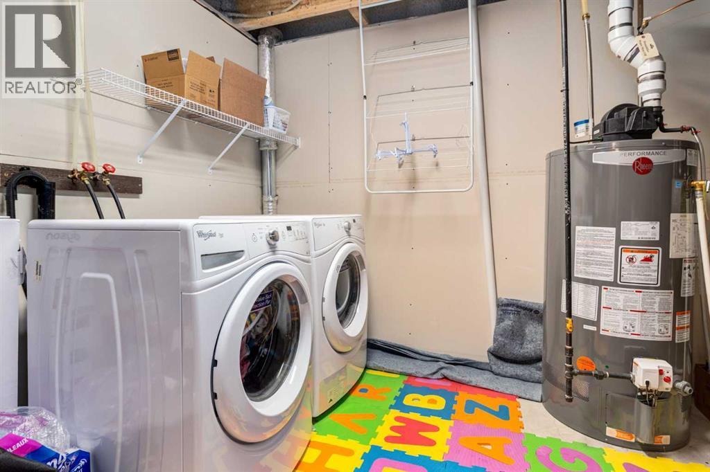 152 New Brighton Grove Se, Calgary, AB - Indoor Photo Showing Laundry Room