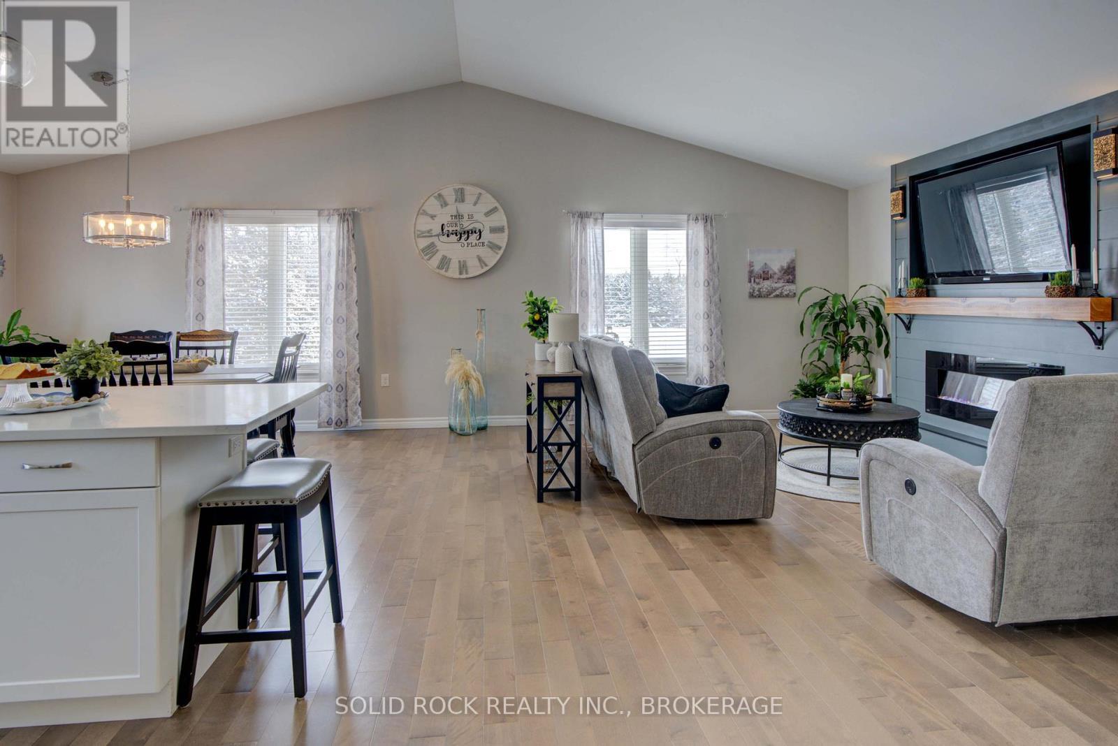 3645 Murvale Road, Frontenac (Frontenac South), ON - Indoor Photo Showing Living Room With Fireplace