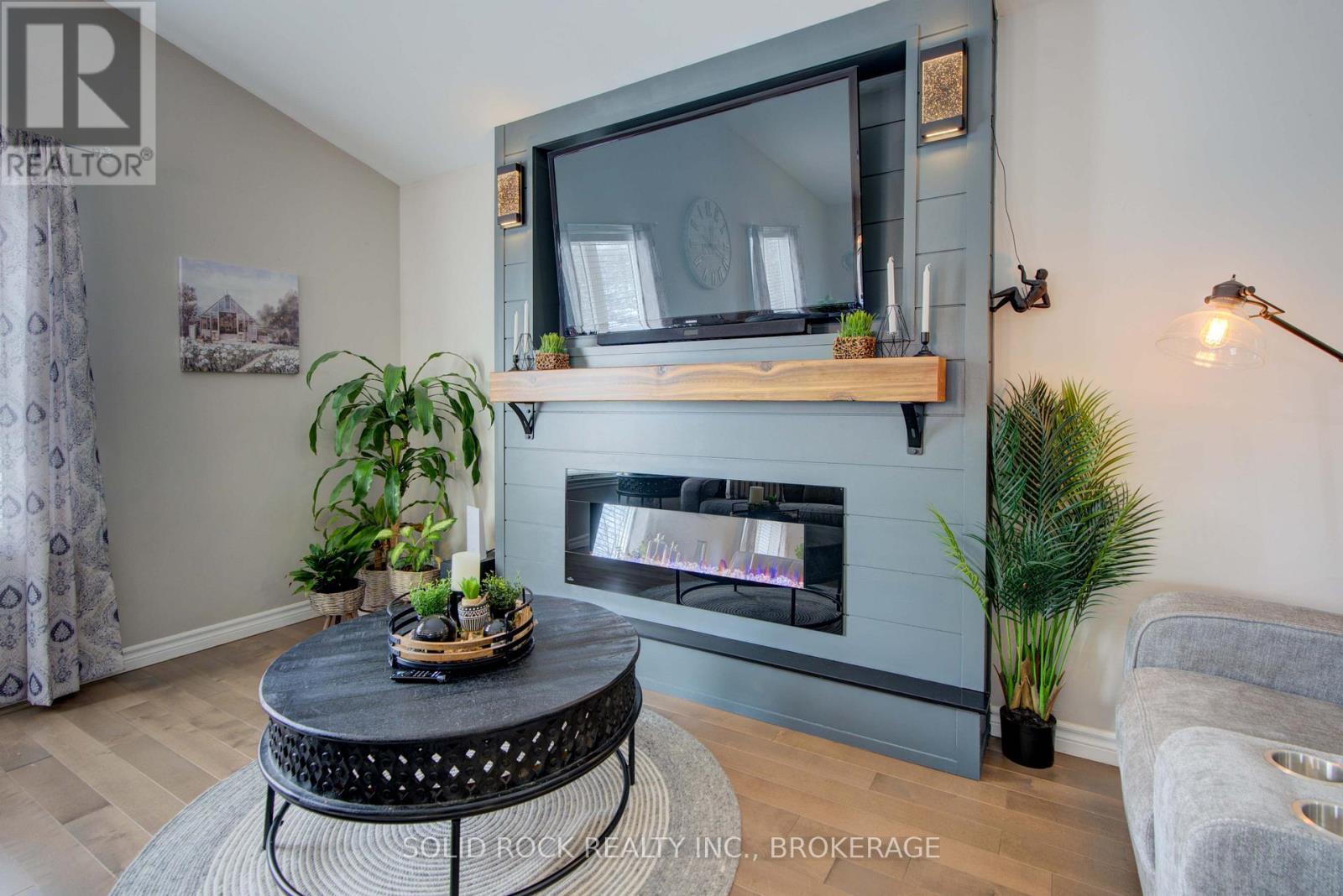 3645 Murvale Road, Frontenac (Frontenac South), ON - Indoor Photo Showing Living Room With Fireplace