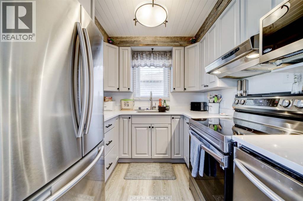 Stainless Steel Appliances - 1510 12 Avenue N, Lethbridge, AB - Indoor Photo Showing Kitchen