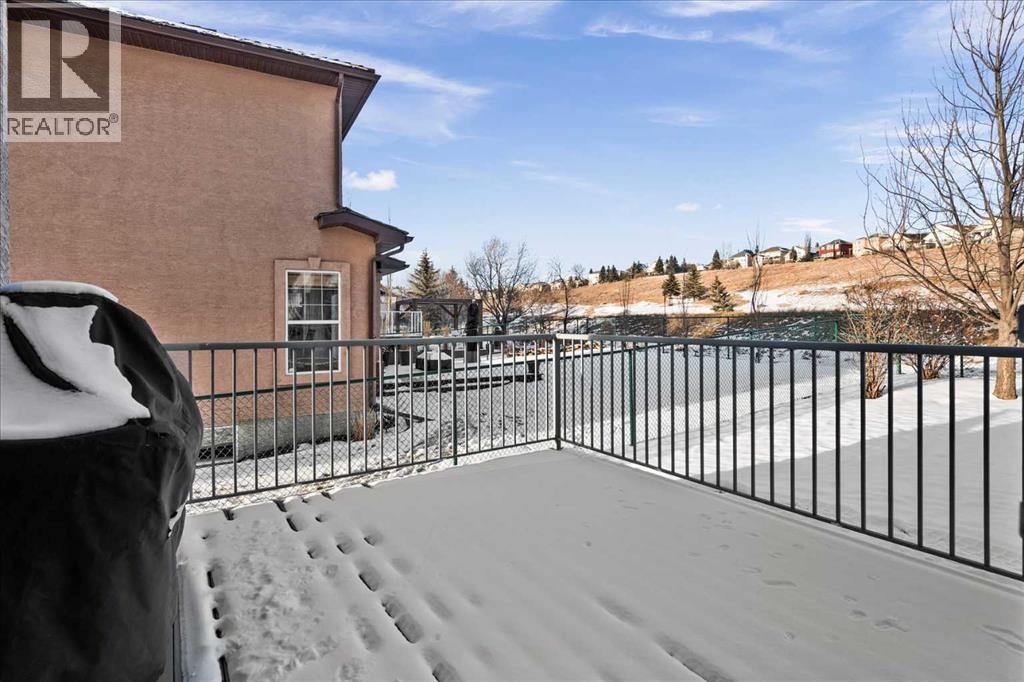 Back deck with BBQ line - 255 Gleneagles View, Cochrane, AB - Outdoor With Balcony