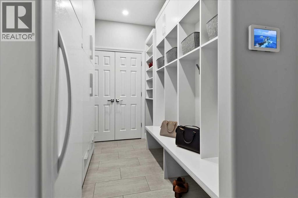 Impressive doube cupboard and built-in cubbies - 255 Gleneagles View, Cochrane, AB - Indoor