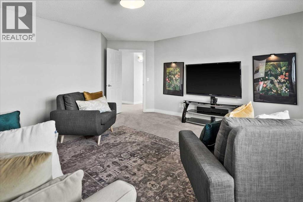 255 Gleneagles View, Cochrane, AB - Indoor Photo Showing Living Room