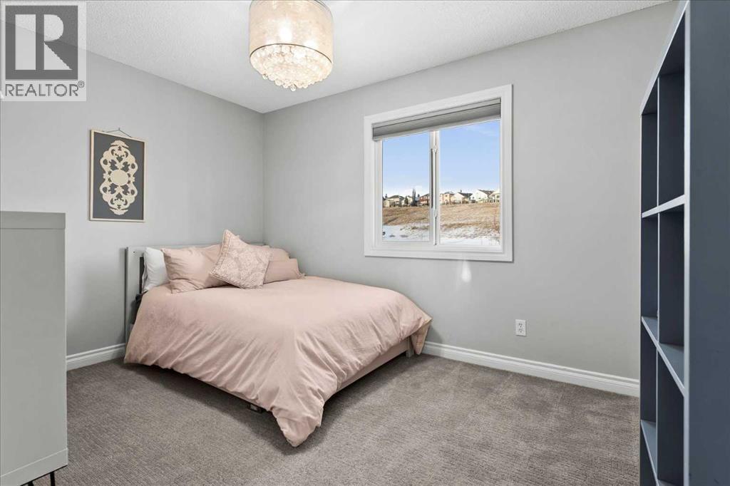 3rd bedroom - 255 Gleneagles View, Cochrane, AB - Indoor Photo Showing Bedroom