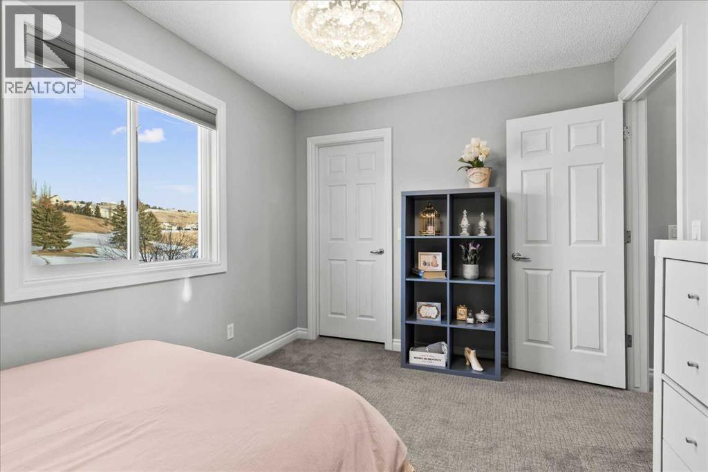 255 Gleneagles View, Cochrane, AB - Indoor Photo Showing Bedroom