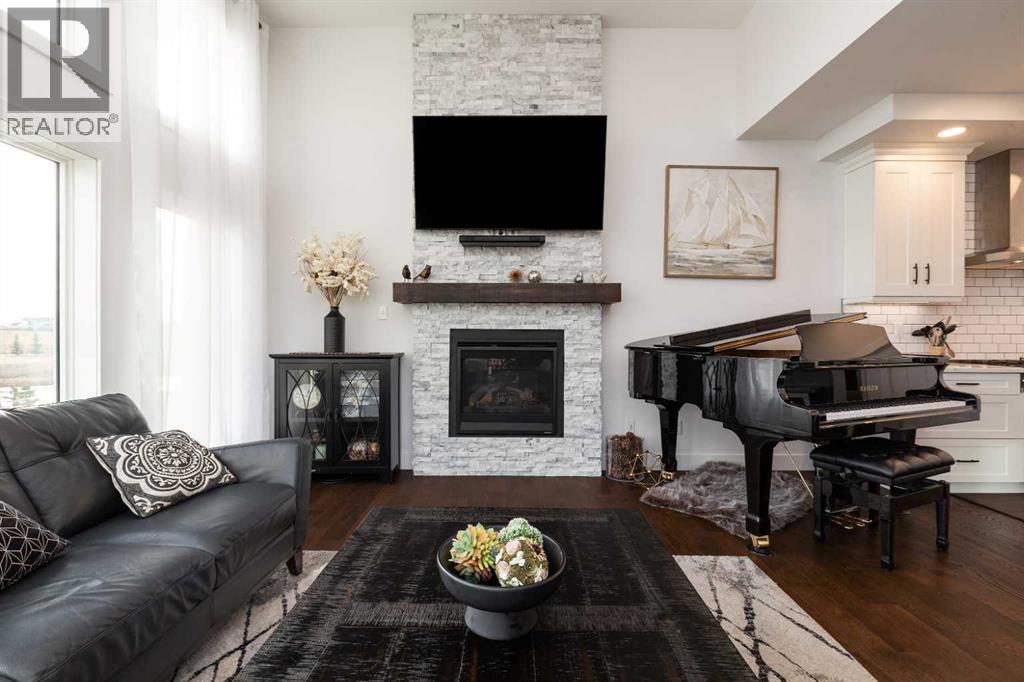 131 Goldenrod Way W, Lethbridge, AB - Indoor Photo Showing Living Room With Fireplace