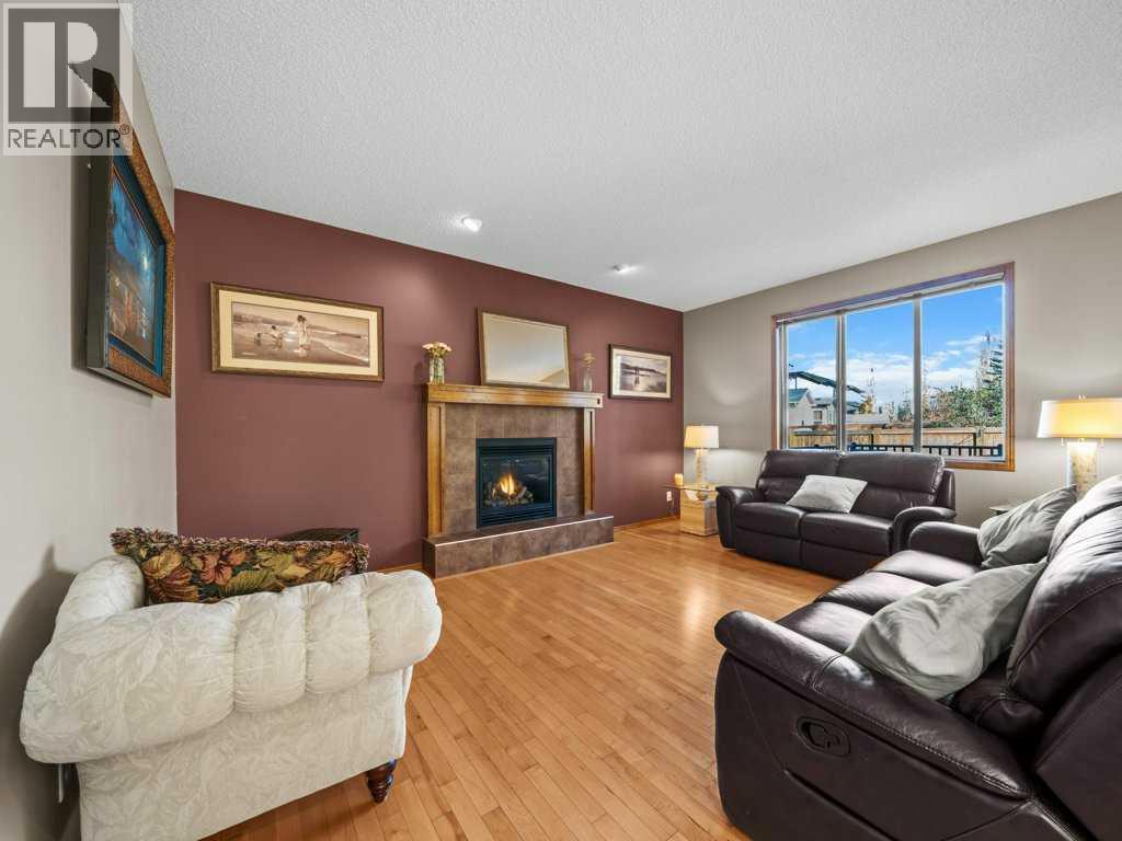 108 Pantego Rise Nw, Calgary, AB - Indoor Photo Showing Living Room With Fireplace