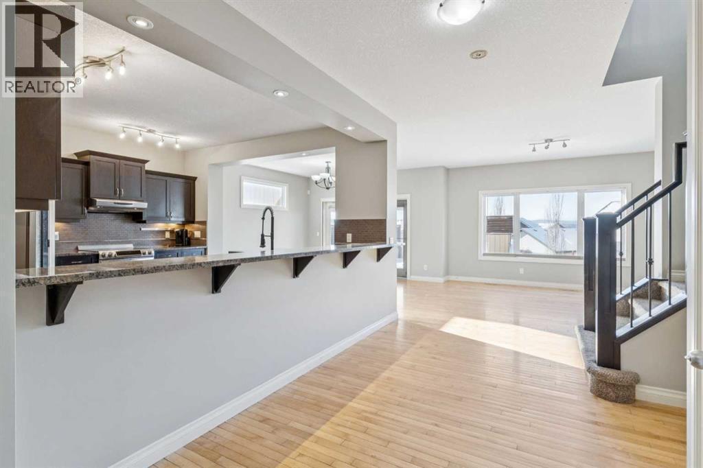 Enterence to Living Room - 110 Heritage Place Ne, Cochrane, AB - Indoor Photo Showing Kitchen With Upgraded Kitchen