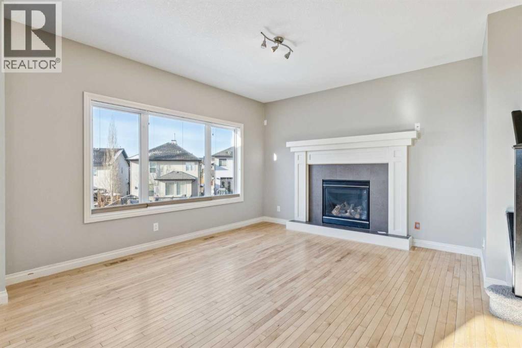 Living Area - 110 Heritage Place Ne, Cochrane, AB - Indoor Photo Showing Living Room With Fireplace