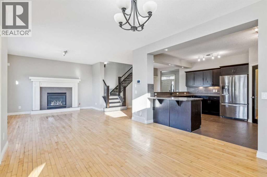 Dining Area #2 - 110 Heritage Place Ne, Cochrane, AB - Indoor With Fireplace