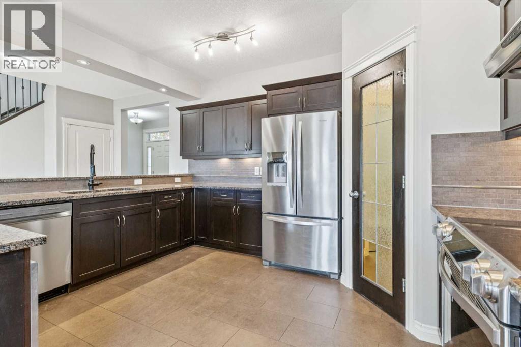 Kitchen - 110 Heritage Place Ne, Cochrane, AB - Indoor Photo Showing Kitchen With Upgraded Kitchen