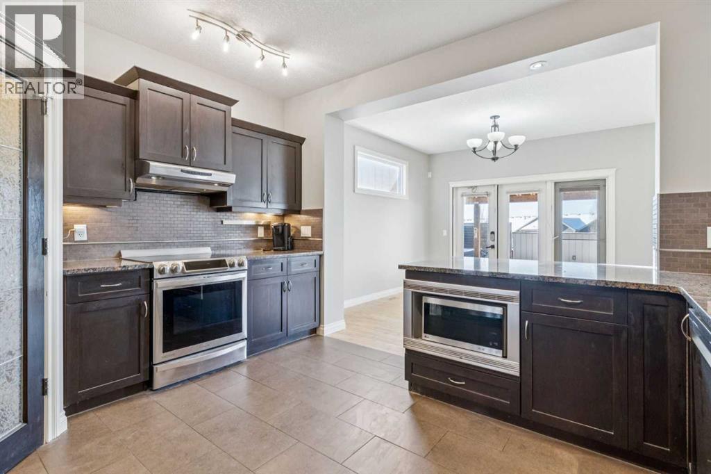 Kitchen #2 - 110 Heritage Place Ne, Cochrane, AB - Indoor Photo Showing Kitchen With Upgraded Kitchen