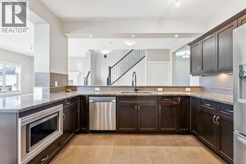 Kitchen #3 - 110 Heritage Place Ne, Cochrane, AB - Indoor Photo Showing Kitchen With Upgraded Kitchen