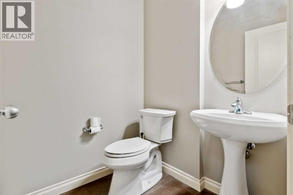 Main Powder Room - 110 Heritage Place Ne, Cochrane, AB - Indoor Photo Showing Bathroom