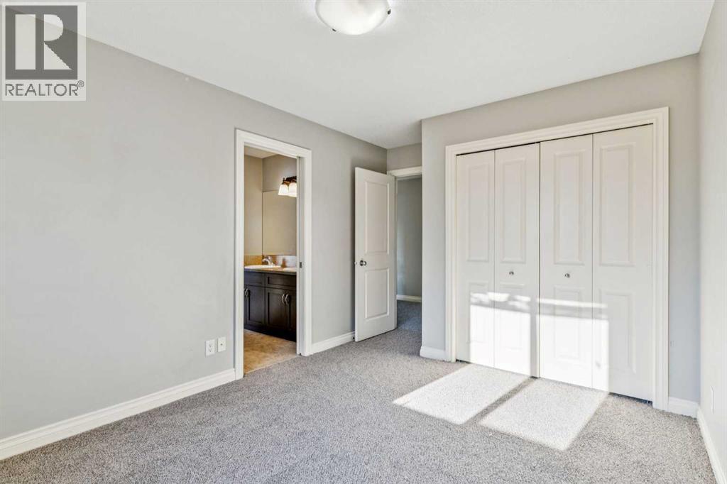 3rd Bedroom Closet - 110 Heritage Place Ne, Cochrane, AB - Indoor