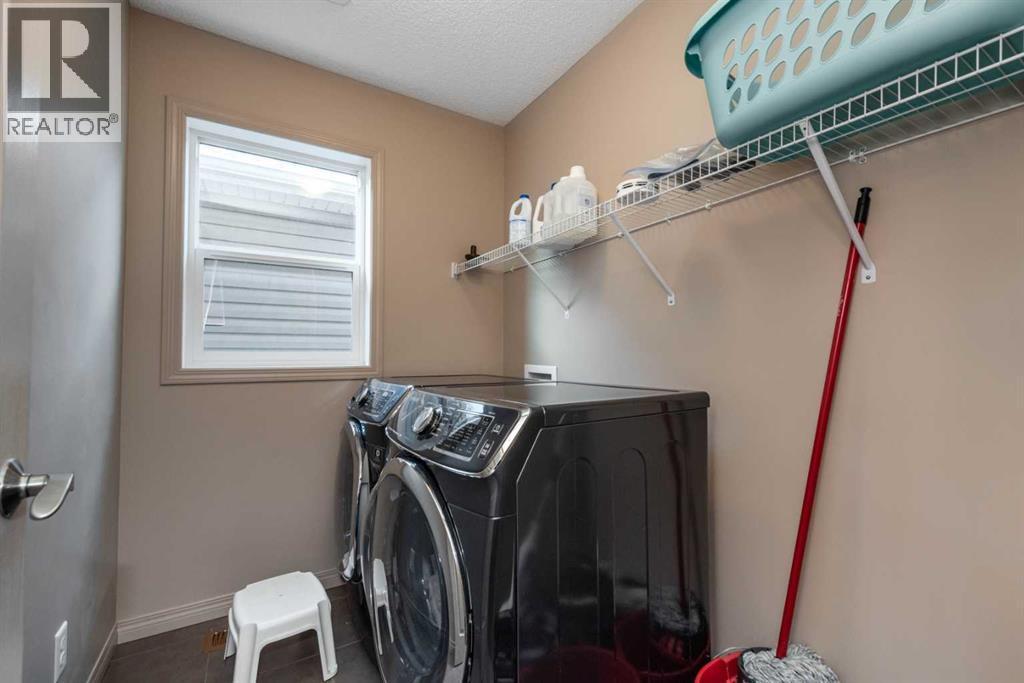 54 Cranford Bay Se, Calgary, AB - Indoor Photo Showing Laundry Room