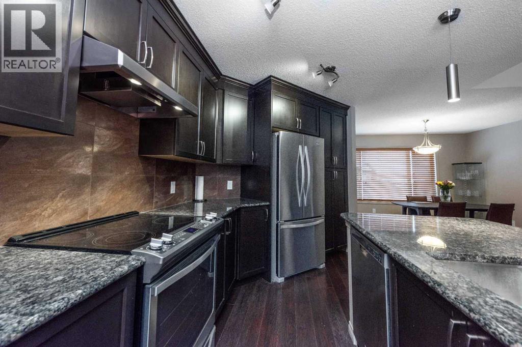 54 Cranford Bay Se, Calgary, AB - Indoor Photo Showing Kitchen With Upgraded Kitchen