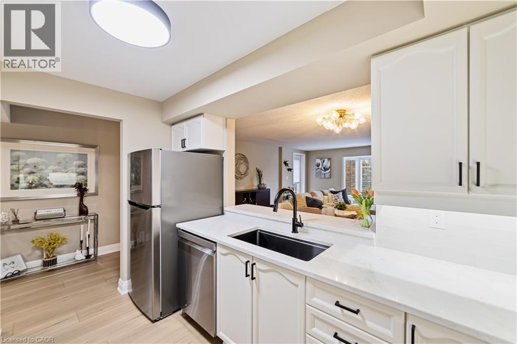 New stainless steel appliances - 216 Plains Road W Unit# B403, Burlington, ON - Indoor Photo Showing Kitchen