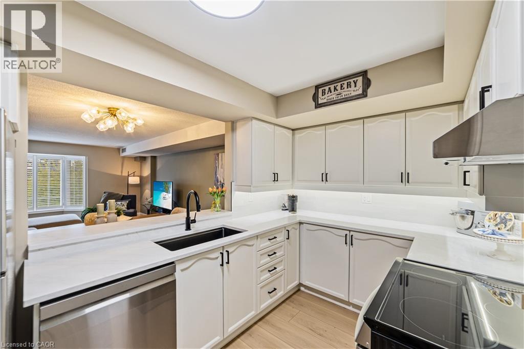 New quartz counter - 216 Plains Road W Unit# B403, Burlington, ON - Indoor Photo Showing Kitchen