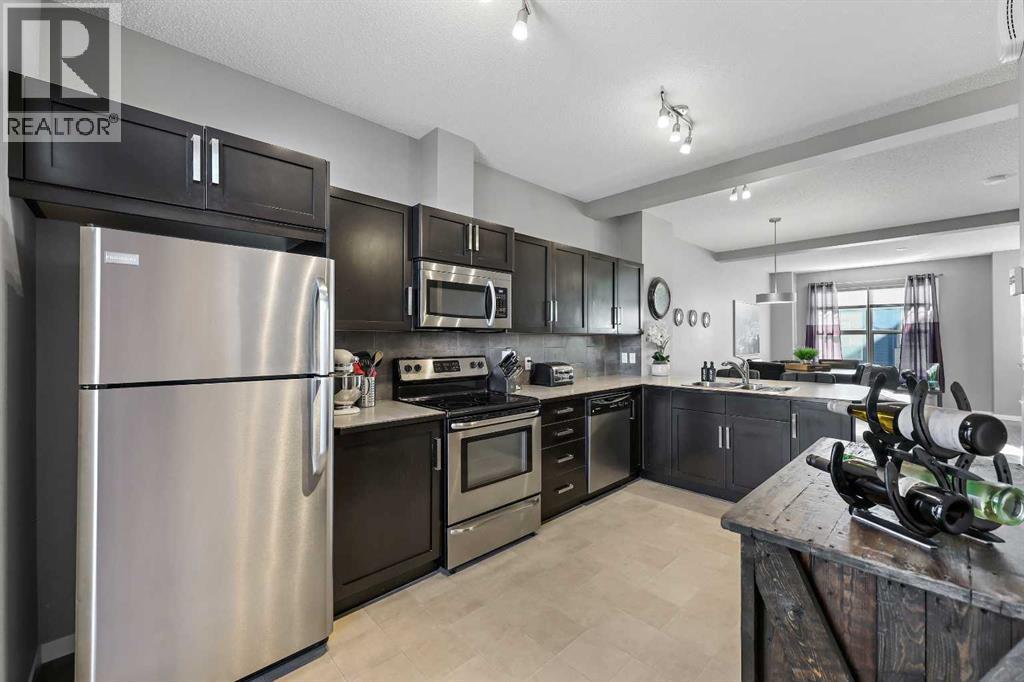 68 New Brighton Point Se, Calgary, AB - Indoor Photo Showing Kitchen With Stainless Steel Kitchen With Double Sink With Upgraded Kitchen