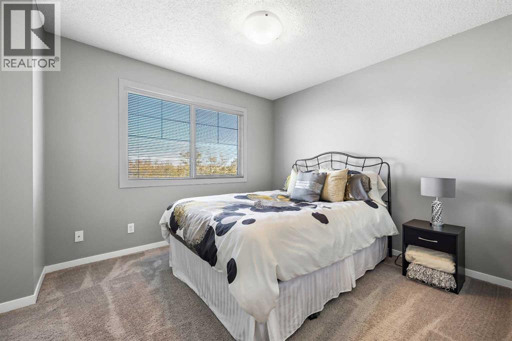 68 New Brighton Point Se, Calgary, AB - Indoor Photo Showing Bedroom
