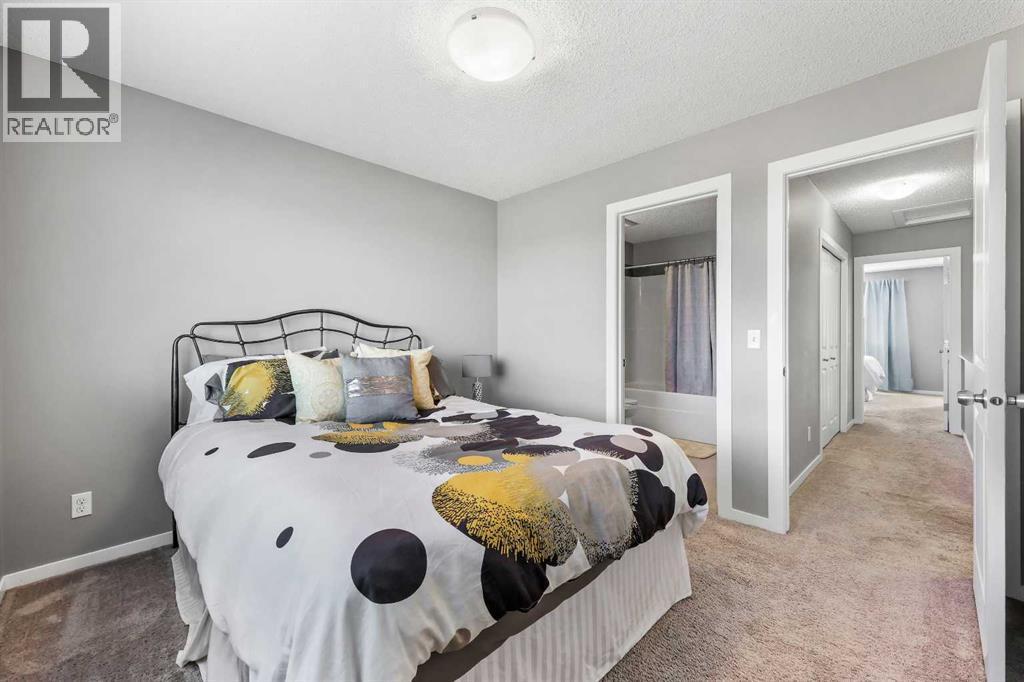 68 New Brighton Point Se, Calgary, AB - Indoor Photo Showing Bedroom