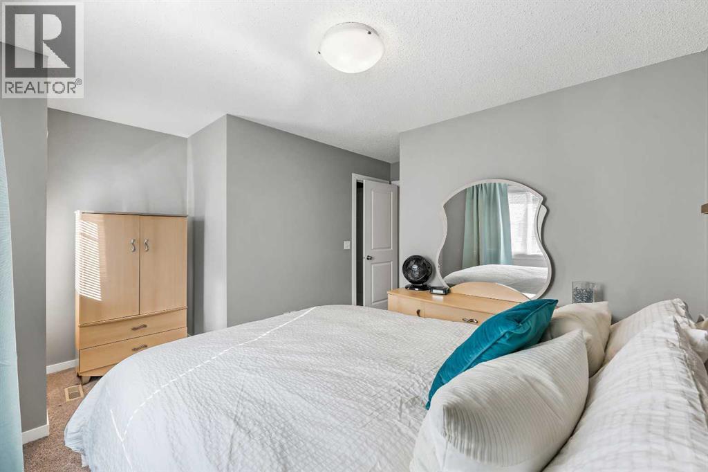 68 New Brighton Point Se, Calgary, AB - Indoor Photo Showing Bedroom