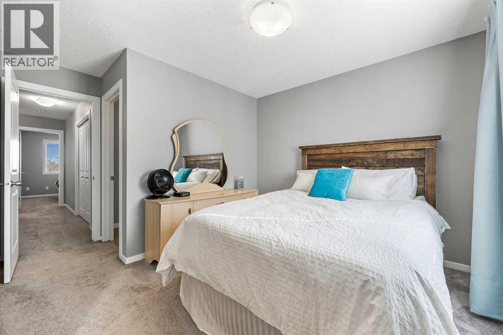 68 New Brighton Point Se, Calgary, AB - Indoor Photo Showing Bedroom