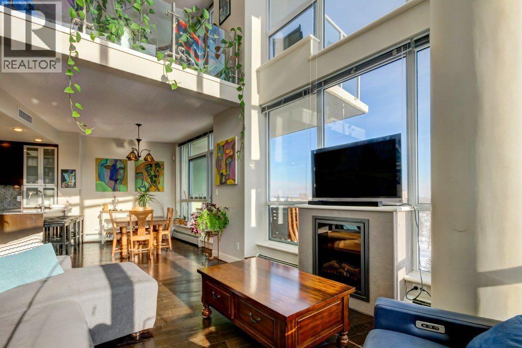 Your gas firepalce for chilly evenings - 602, 99 Spruce Place Sw, Calgary, AB - Indoor Photo Showing Living Room With Fireplace